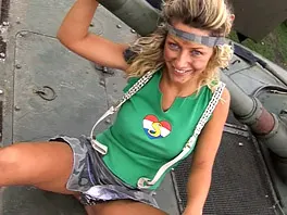 Christine masturbates inside an army vehicle