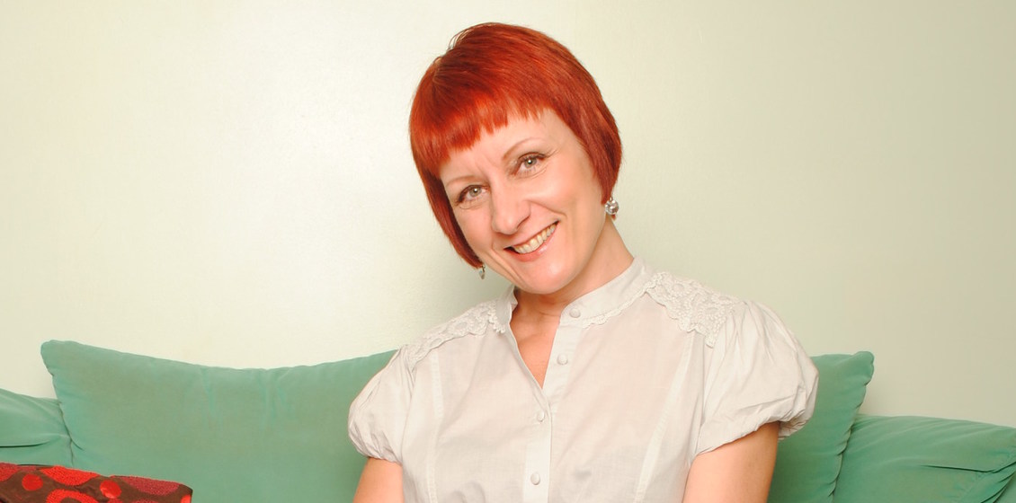 Sexy mature redhead shows off her hot body