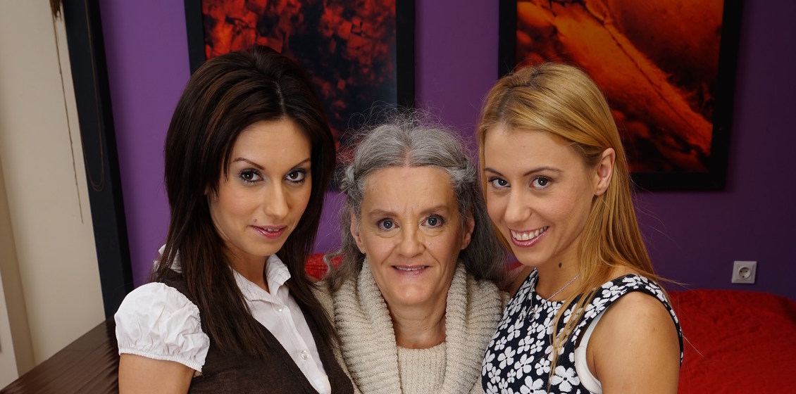 Horny Granny watches two babes muffdiving and joins in for a pussy licking hot lesbian threesome