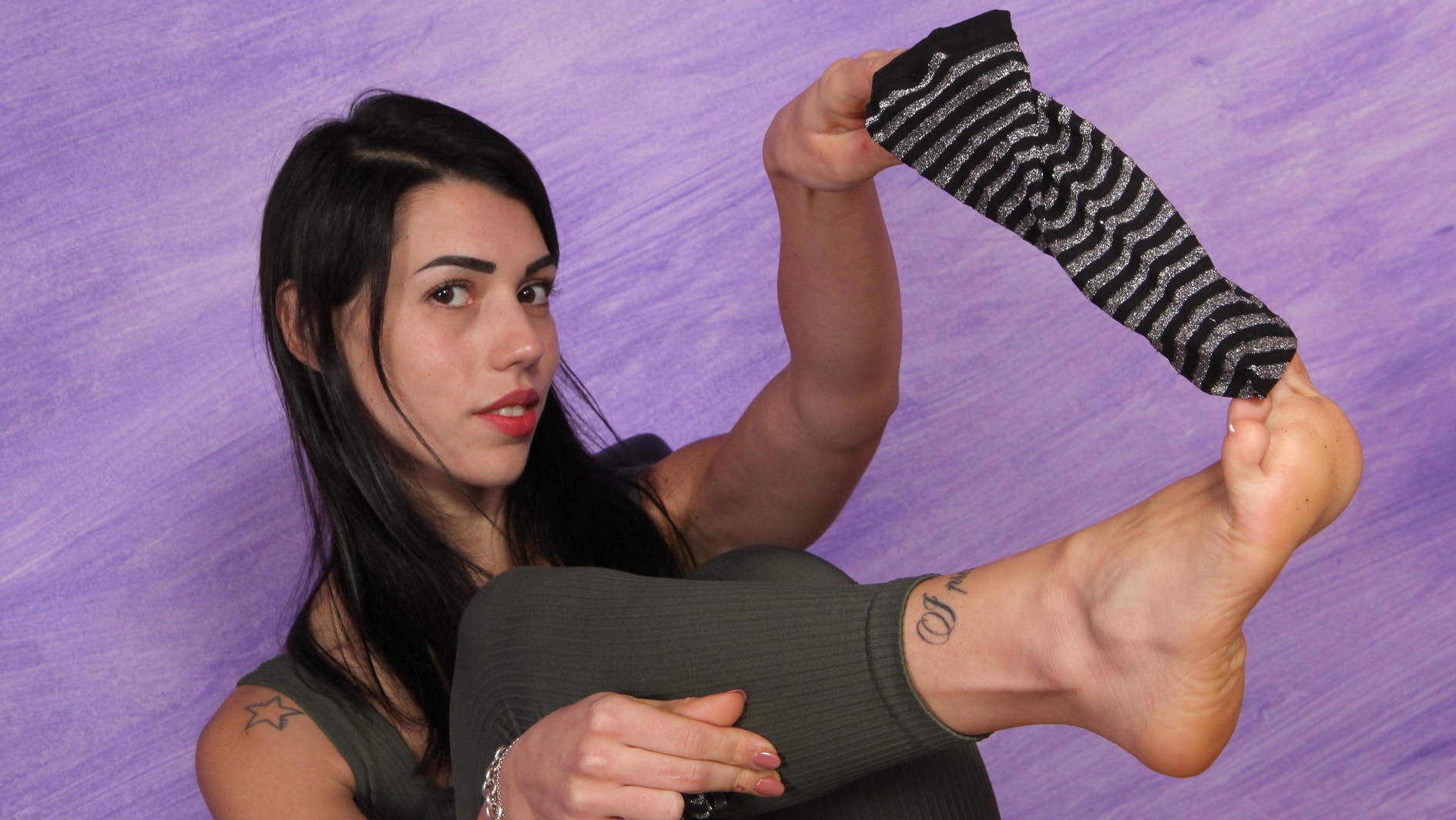 Petra flaunts her smelly feet after a sweaty workout session