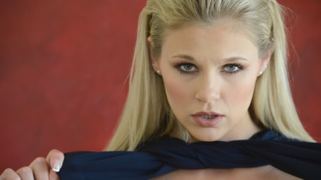 Blonde teen Scarlet Red masturbates on a table
